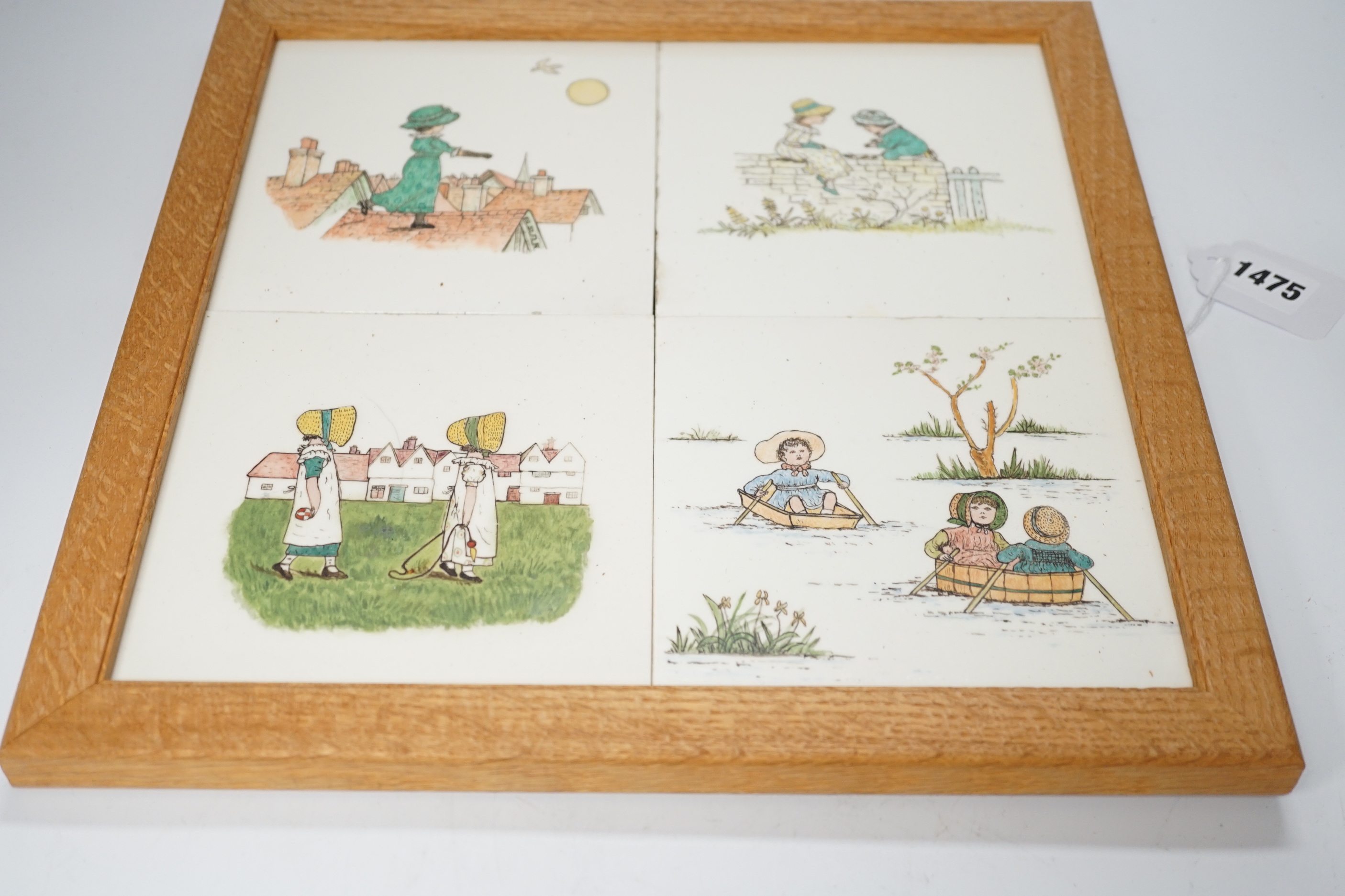 A set of four oak framed Minton tiles outside decorated illustrations after Kate Greenaway, 34 x 34cm